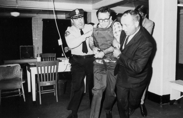 02James Earl Ray being brought into jail 02.jpg